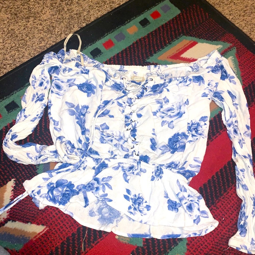Gimmicks off the shoulder top